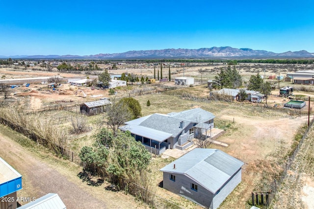 drone / aerial view featuring a mountain view and a rural view