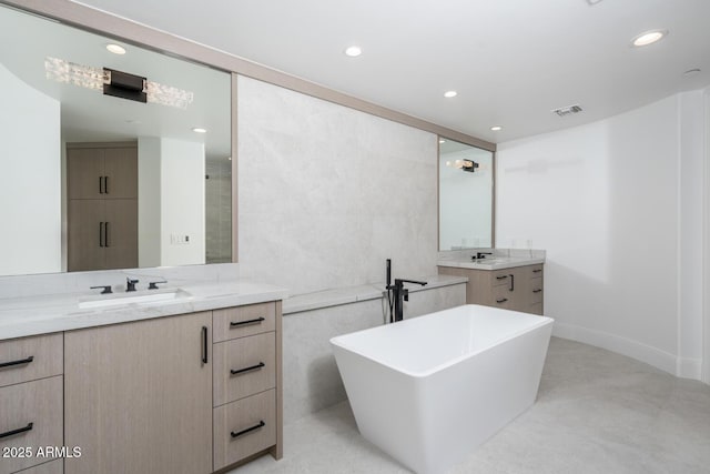 bathroom with a bathing tub and vanity