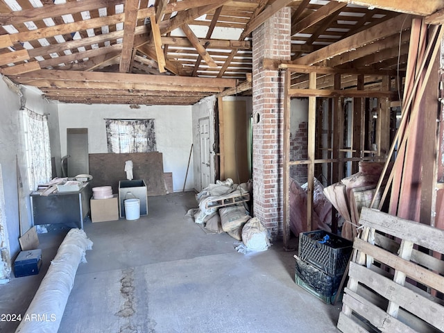 misc room featuring concrete floors and vaulted ceiling