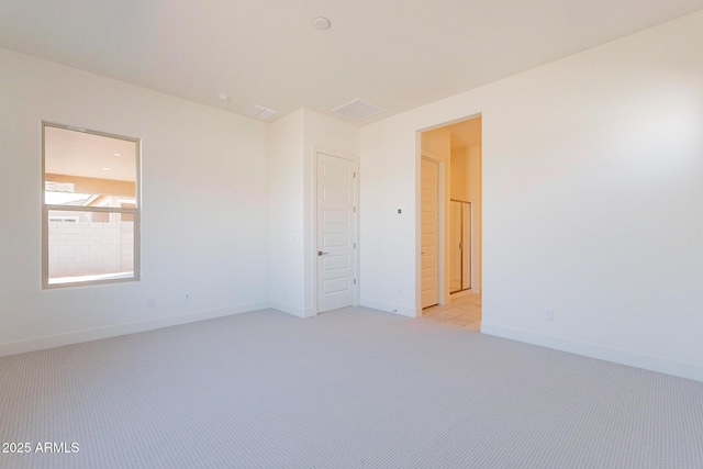 18950 W Ocotillo Rd, Waddell, AZ 85355 - unfurnished room featuring light carpet and baseboards