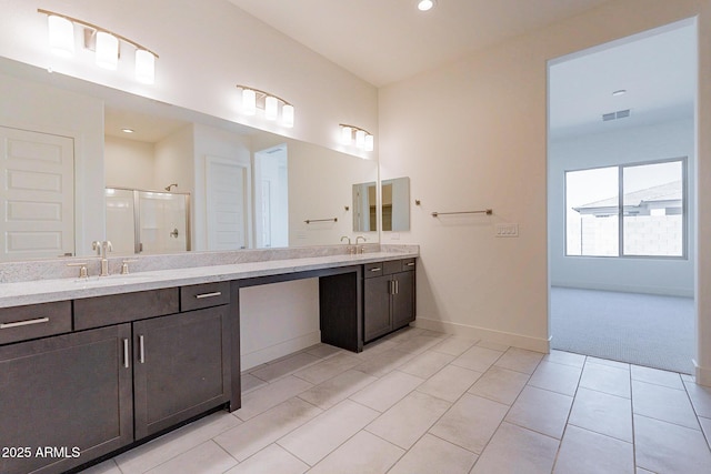 18950 W Ocotillo Rd, Waddell, AZ 85355 - bathroom with a shower stall, vanity, baseboards, tile patterned flooring, and visible vents