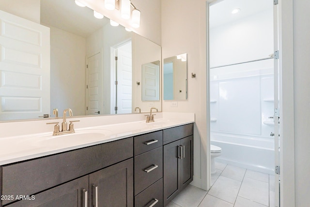 18950 W Ocotillo Rd, Waddell, AZ 85355 - bathroom with tile patterned floors, a sink, double vanity, and toilet