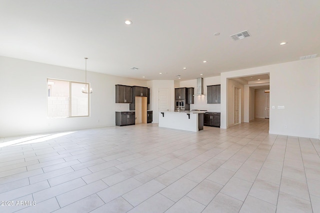 18950 W Ocotillo Rd, Waddell, AZ 85355 - unfurnished living room featuring a chandelier, visible vents, and recessed lighting