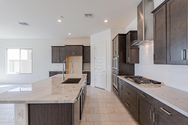 18950 W Ocotillo Rd, Waddell, AZ 85355 - kitchen featuring wall chimney exhaust hood, stainless steel appliances, a sink, and visible vents