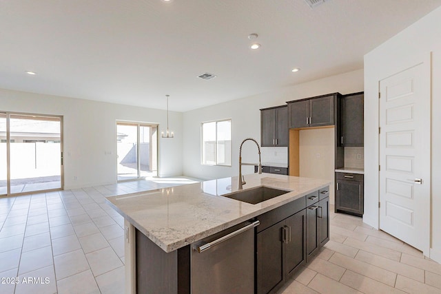 18950 W Ocotillo Rd, Waddell, AZ 85355 - kitchen featuring visible vents, stainless steel dishwasher, light tile patterned floors, a sink, and a chandelier
