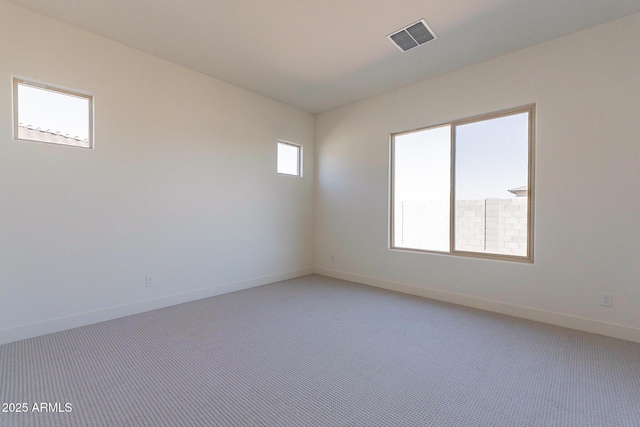 18950 W Ocotillo Rd, Waddell, AZ 85355 - empty room with light colored carpet, baseboards, and visible vents