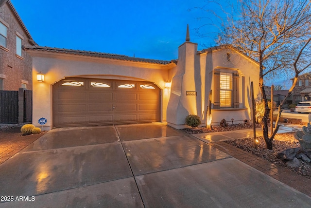 mediterranean / spanish house with a garage