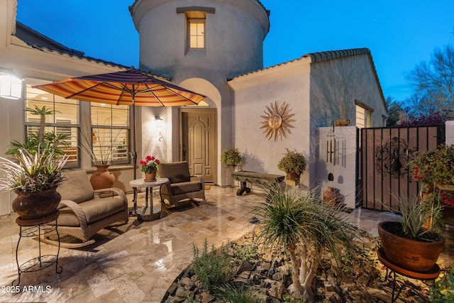 view of patio terrace at dusk