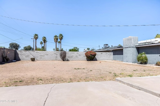 view of yard featuring a patio and a fenced backyard