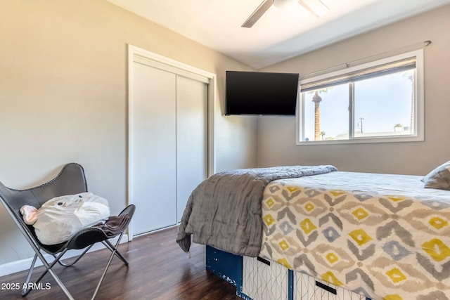 bedroom featuring a closet, a ceiling fan, and dark wood finished floors