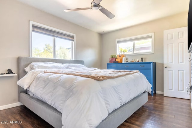 bedroom featuring dark wood-style flooring, baseboards, and a ceiling fan