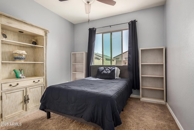 bedroom featuring light carpet, baseboards, and ceiling fan