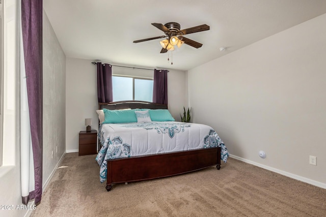 bedroom featuring baseboards, carpet floors, and ceiling fan