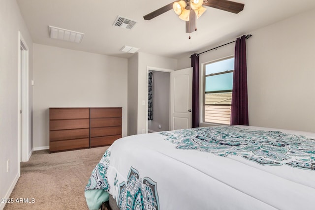 bedroom featuring baseboards, visible vents, ceiling fan, and carpet