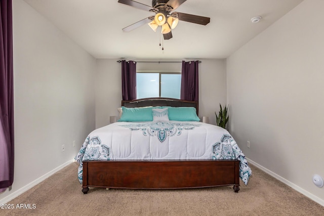 bedroom with baseboards, ceiling fan, and carpet