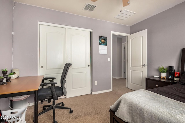 carpeted bedroom with baseboards, a closet, and visible vents
