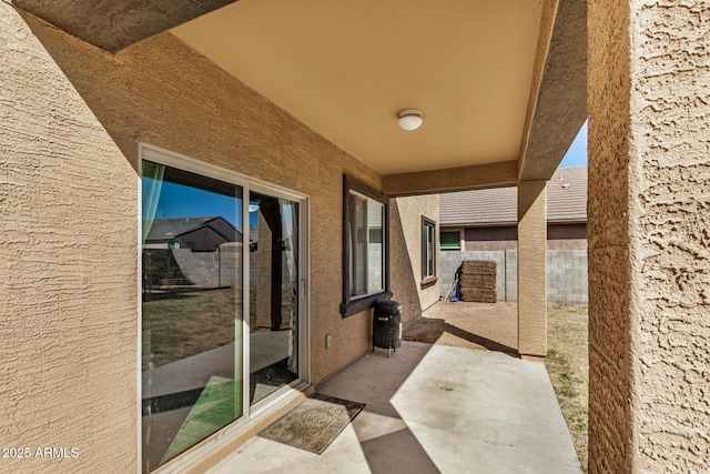 view of patio / terrace with fence