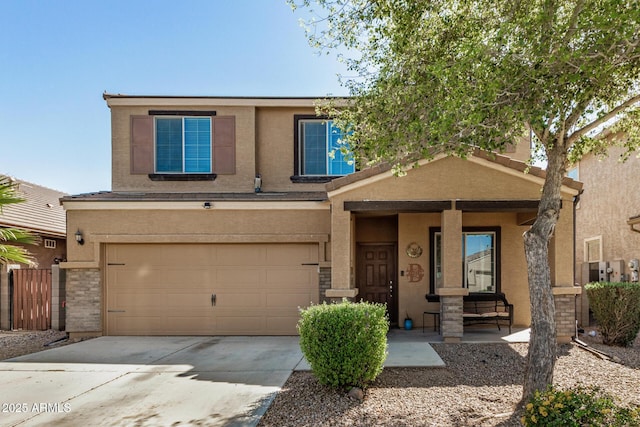 view of front of property featuring stucco siding, a garage, concrete driveway, and a porch