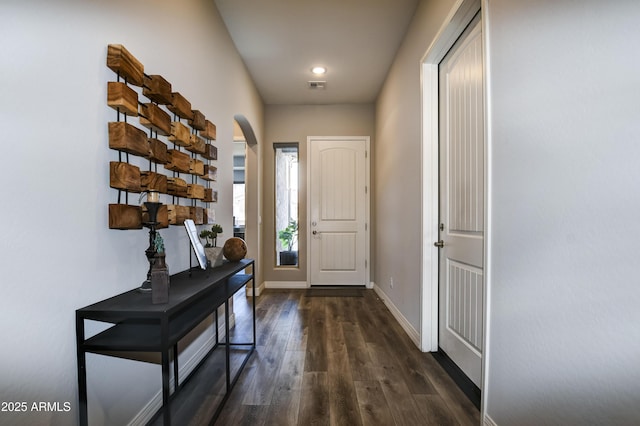 doorway to outside with dark hardwood / wood-style floors