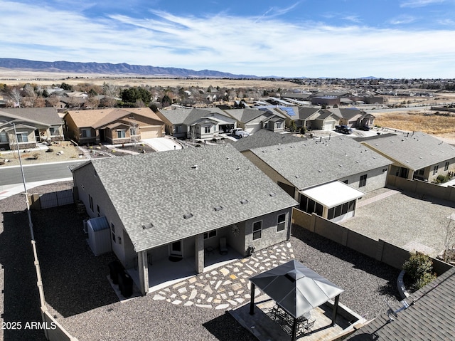 birds eye view of property with a mountain view