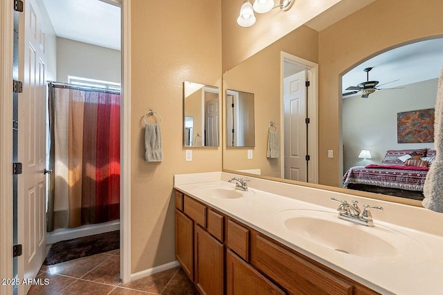 full bathroom with tile patterned flooring, a sink, ensuite bath, and ceiling fan