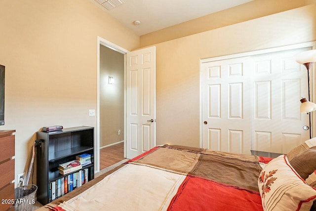 bedroom featuring visible vents