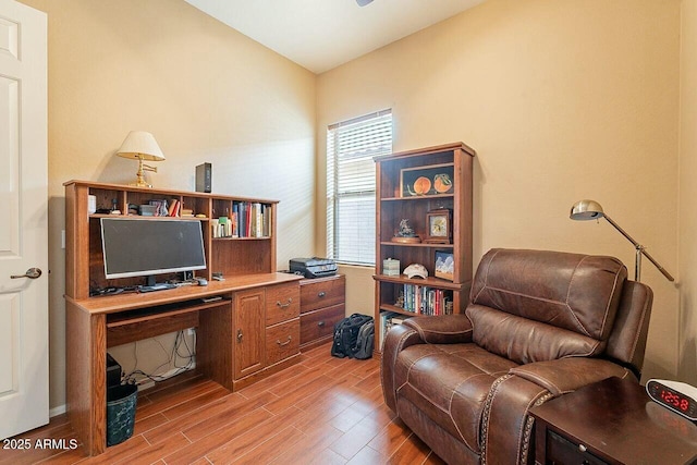 office with light wood-type flooring