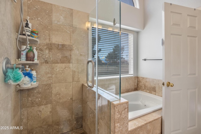 bathroom featuring a stall shower and a garden tub