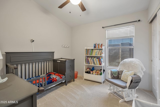 bedroom with carpet, vaulted ceiling, and ceiling fan