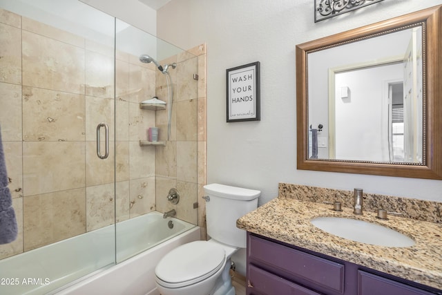 full bath with shower / bath combination with glass door, vanity, and toilet