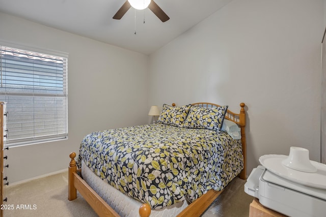 bedroom featuring carpet floors, baseboards, and a ceiling fan