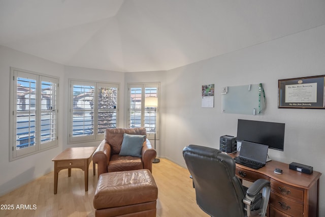 office area featuring lofted ceiling and wood finished floors