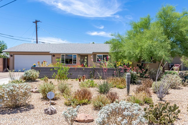 6749 E Lewis Ave, Scottsdale, AZ 85257 - ranch-style home with stucco siding, driveway, an attached garage, and roof with shingles