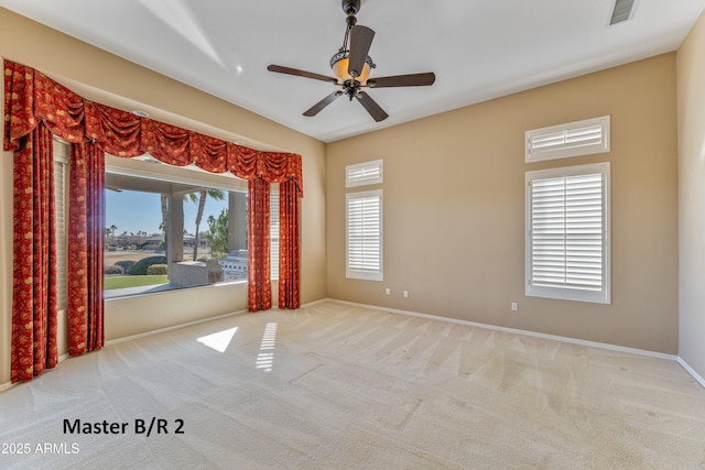 unfurnished room featuring ceiling fan and light colored carpet