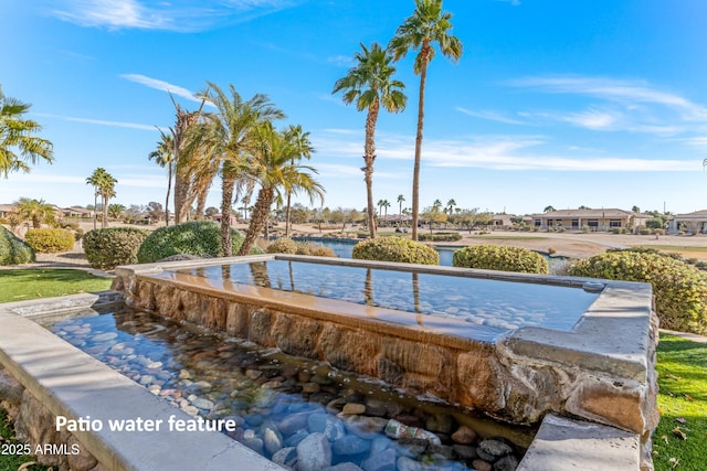 view of community with a water view