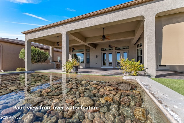 back of house with ceiling fan, french doors, and a patio