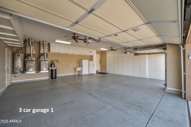 garage featuring ceiling fan, sink, a garage door opener, and gas water heater