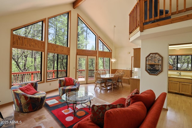 9434 W Obier Dr, Pine, AZ 85544 - living area featuring wood finished floors, beam ceiling, and high vaulted ceiling
