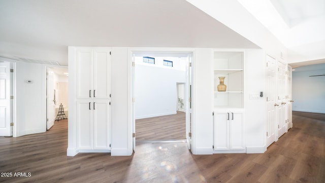 corridor featuring dark hardwood / wood-style flooring