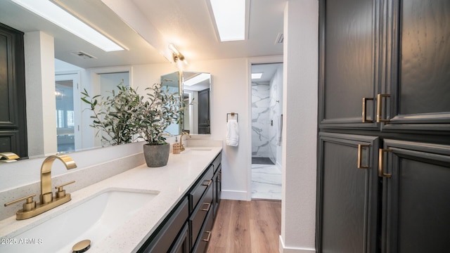 bathroom featuring vanity and hardwood / wood-style flooring