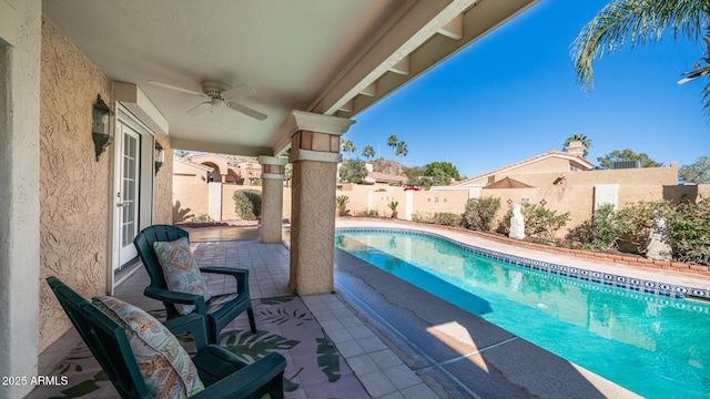 view of swimming pool featuring ceiling fan