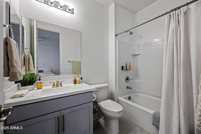 full bathroom with toilet, ensuite bath, wood finished floors, shower / bath combo with shower curtain, and vanity