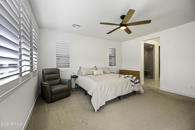 bedroom featuring baseboards, visible vents, a ceiling fan, and light colored carpet