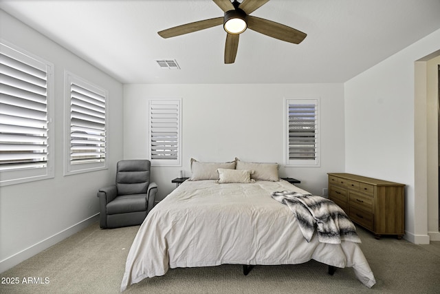 bedroom featuring visible vents, ceiling fan, light carpet, and baseboards