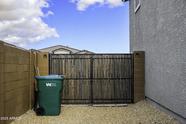 view of gate featuring fence