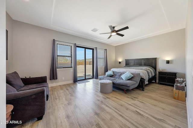 26112 N 7th Ave, Phoenix, AZ 85085 - bedroom featuring access to exterior, light wood finished floors, baseboards, and a ceiling fan