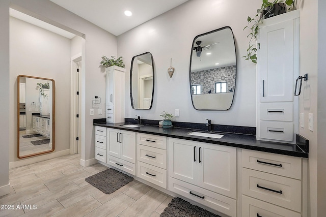 26112 N 7th Ave, Phoenix, AZ 85085 - bathroom with double vanity, wood tiled floors, baseboards, and recessed lighting