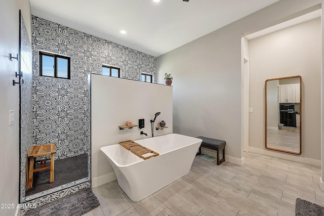 26112 N 7th Ave, Phoenix, AZ 85085 - bathroom featuring baseboards, a soaking tub, a walk in shower, and recessed lighting