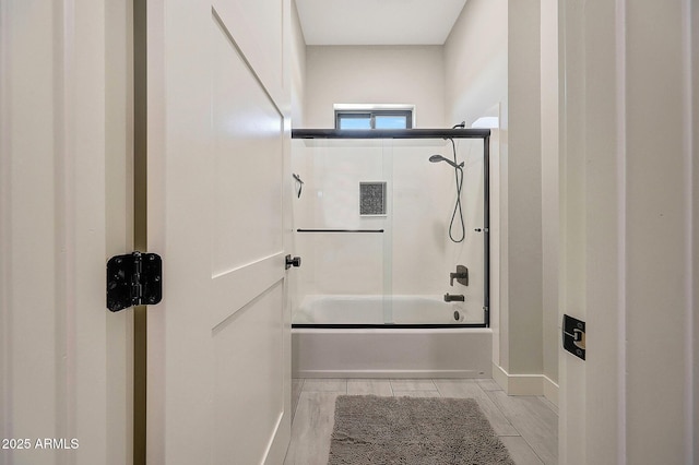 26112 N 7th Ave, Phoenix, AZ 85085 - full bath with combined bath / shower with glass door, wood finish floors, and baseboards