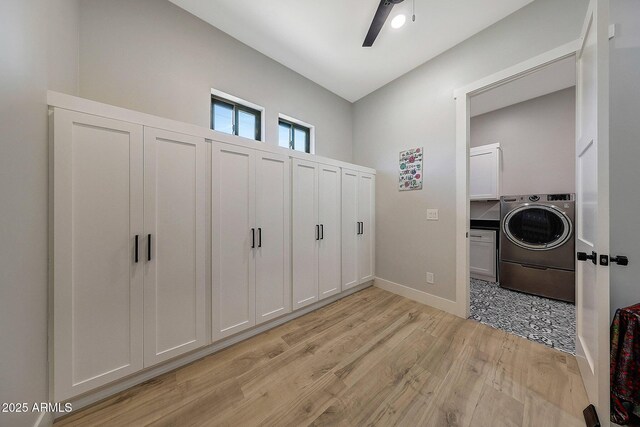 26112 N 7th Ave, Phoenix, AZ 85085 - laundry area with washer / dryer, cabinet space, light wood-style flooring, ceiling fan, and baseboards